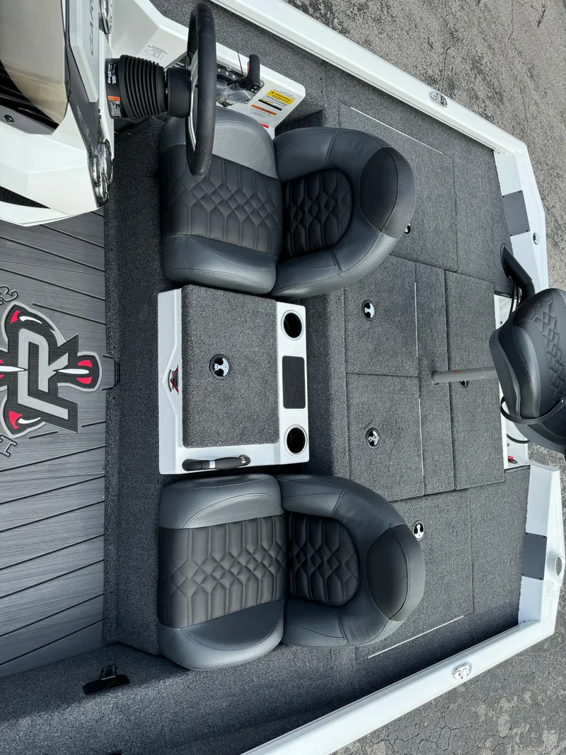 Slide: The Image of 2025 Vexus AVX1980 boat interior with dual black seats and storage compartments. - 13