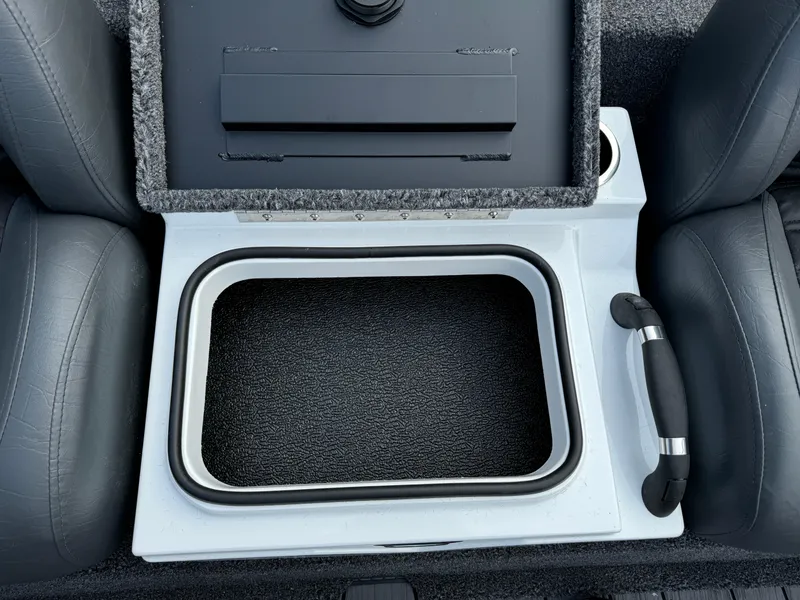 Slide: The Image of Vexus AVX1980 2025 boat interior storage compartment with handle and cup holder. - 15