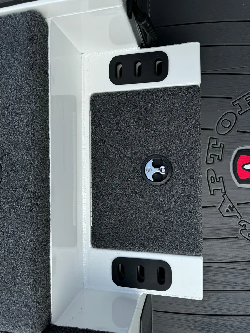 Slide: The Image of 2025 Vexus AVX1980 boat interior with carpeted step and storage compartment. - 17