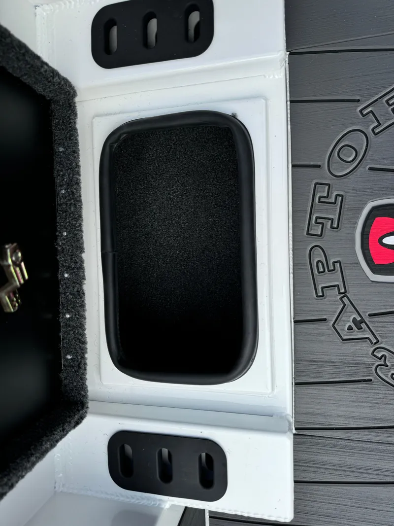 Slide: The Image of 2025 Vexus AVX1980 boat interior storage compartment with black and white design. - 18