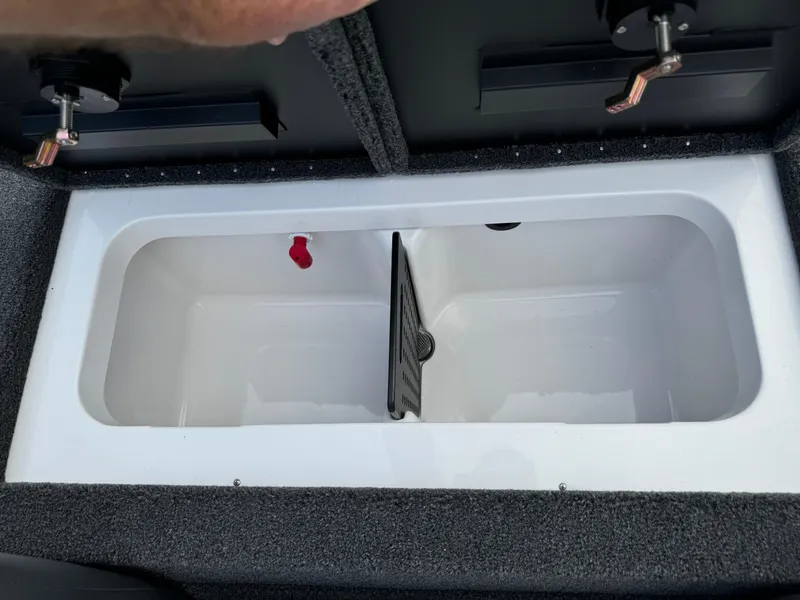 Slide: The Image of Vexus AVX1980 2025 livewell compartment with divider and secure latches. - 29