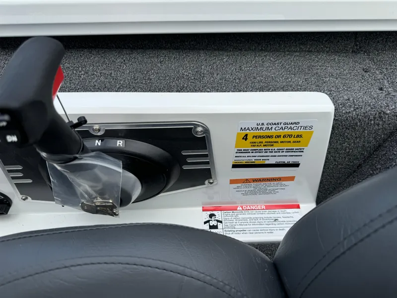 Slide: The Image of Vexus AVX1980 2025 boat control panel with capacity warning label. - 32