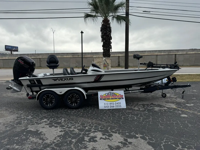 Slide: The Image of 2025 Vexus AVX1980 boat on trailer, parked outdoors near palm tree. - 35