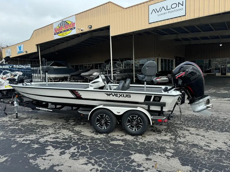 Slide: The Image of 2025 Vexus AVX1980 boat on trailer outside dealership. - 4