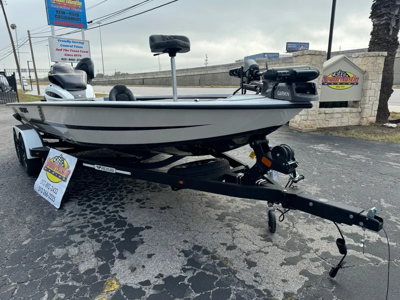 Slide: The Image of 2025 Vexus AVX1980 boat on trailer, parked outdoors, featuring Garmin equipment. - 5