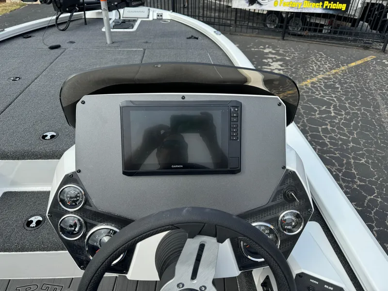 Slide: The Image of 2025 Vexus AVX1980 boat dashboard with steering wheel and electronic display. - 7