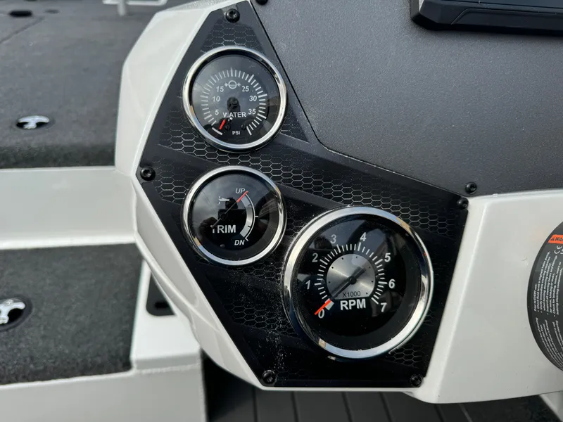 Slide: The Image of Dashboard of 2025 Vexus AVX1980 boat with RPM, trim, and water temperature gauges. - 8