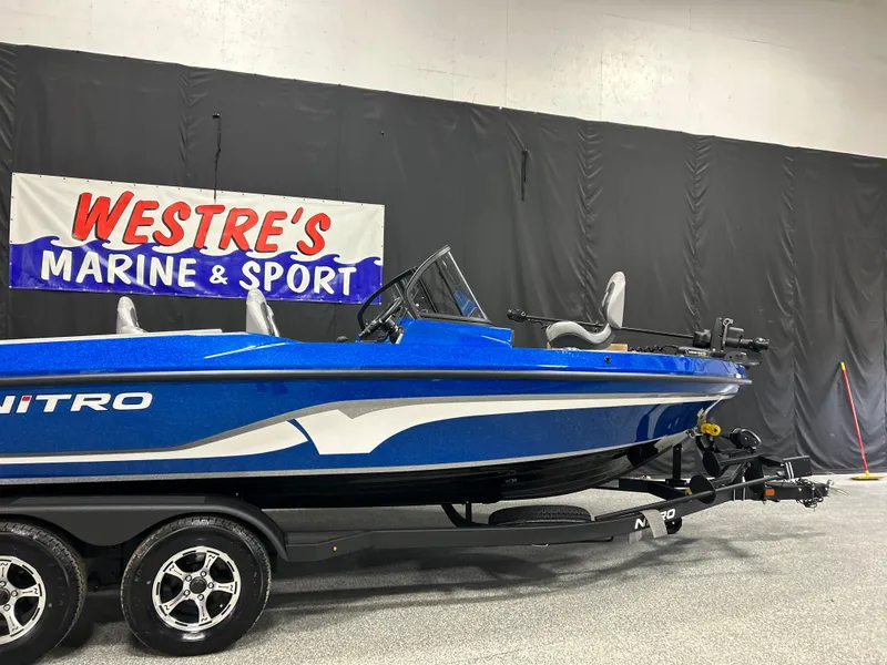 The Image of 2025 Nitro ZV20 boat in showroom, blue exterior, on trailer. - 0