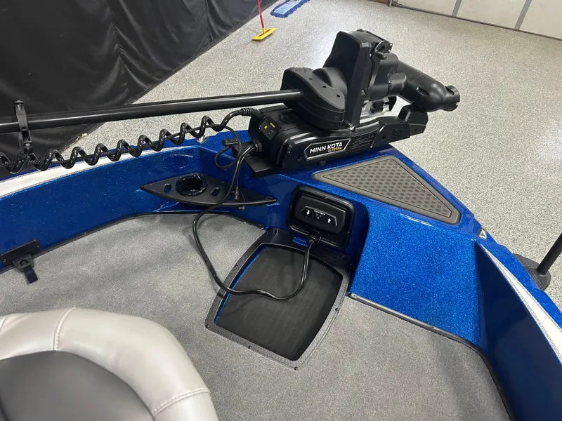 Slide: The Image of 2025 Nitro ZV20 boat with Minn Kota trolling motor on blue deck. - 16