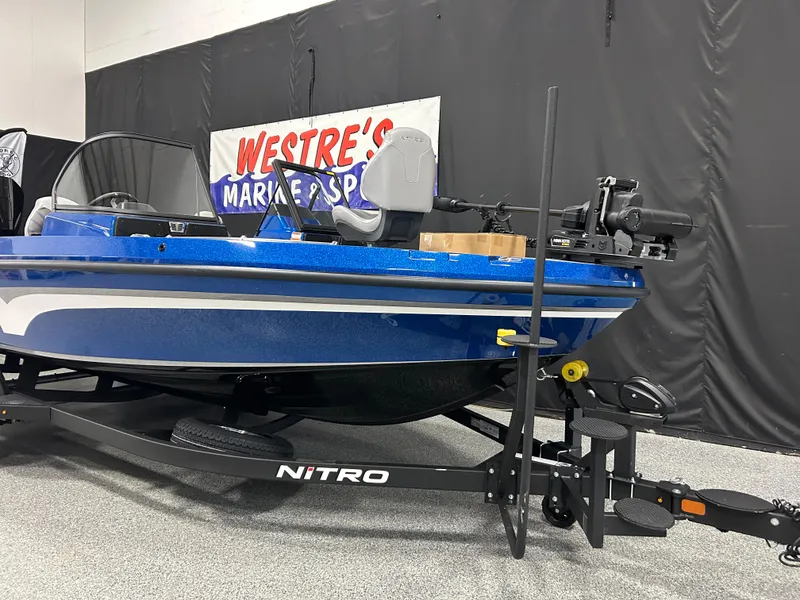 Slide: The Image of 2025 Nitro ZV20 boat in blue, displayed at Westre's Marine & Sport showroom. - 2
