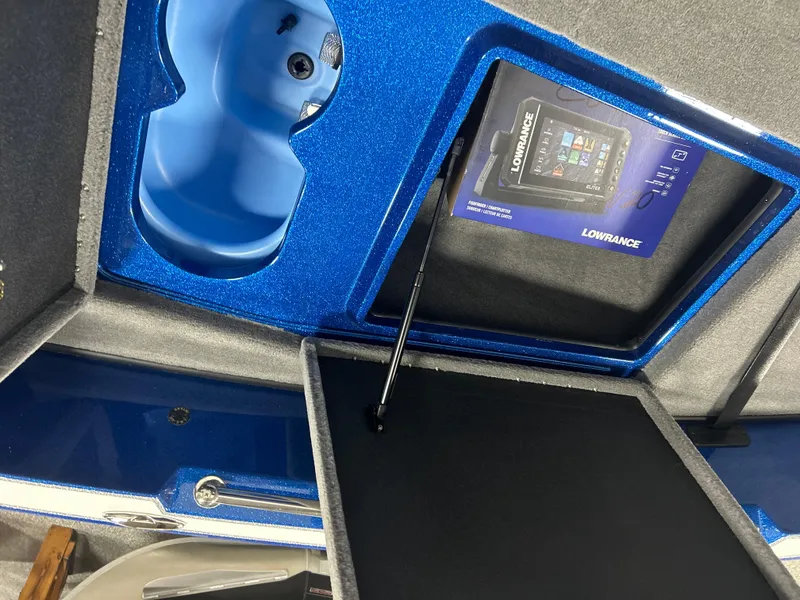 Slide: The Image of 2025 Nitro ZV20 boat interior with Lowrance fishfinder and blue storage compartment. - 20