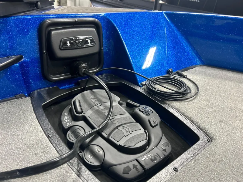 Slide: The Image of 2025 Nitro ZV20 boat control panel with blue metallic finish and advanced navigation system. - 22