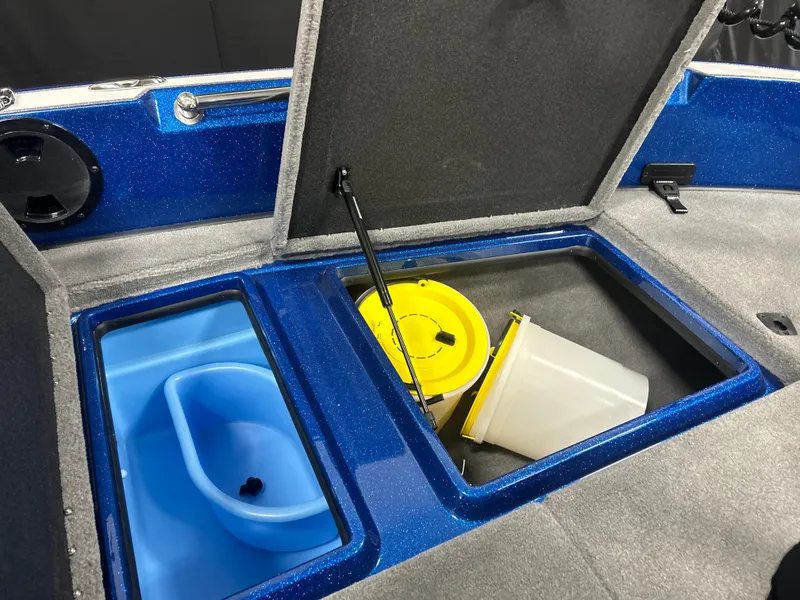 Slide: The Image of 2025 Nitro ZV20 boat storage compartments with blue and yellow containers. - 23