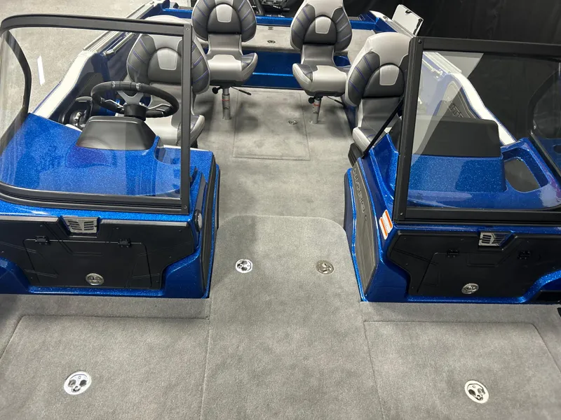 Slide: The Image of 2025 Nitro ZV20 boat interior with gray seating and blue accents. - 25