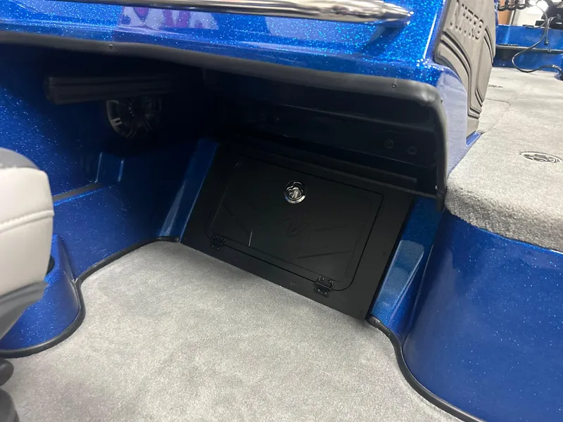 Slide: The Image of 2025 Nitro ZV20 boat interior with blue finish and storage compartment. - 28