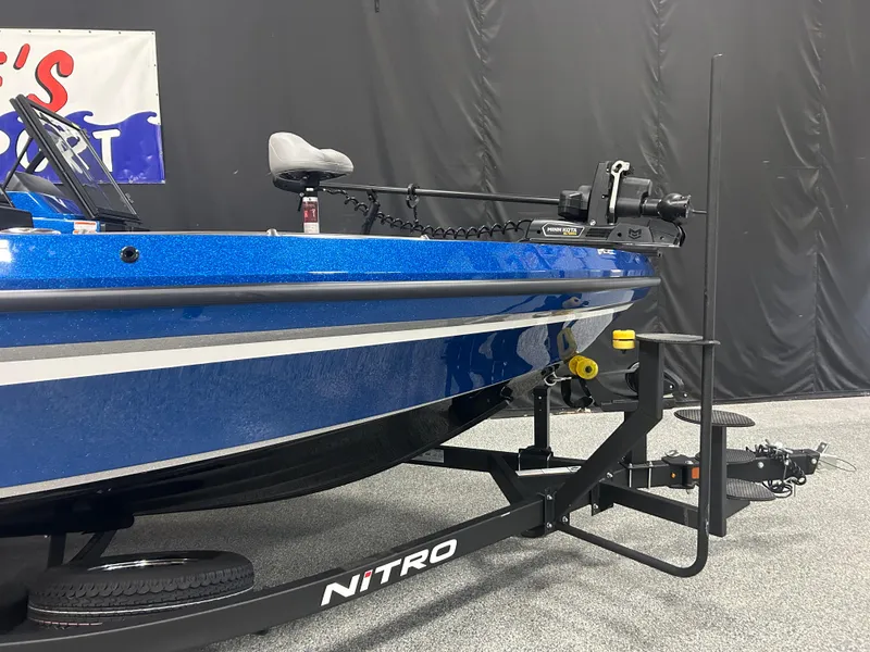 Slide: The Image of 2025 Nitro ZV20 boat on trailer, blue exterior, displayed indoors. - 3