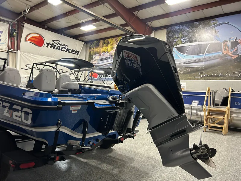 Slide: The Image of 2025 Nitro ZV20 boat with powerful outboard motor in showroom setting. - 7