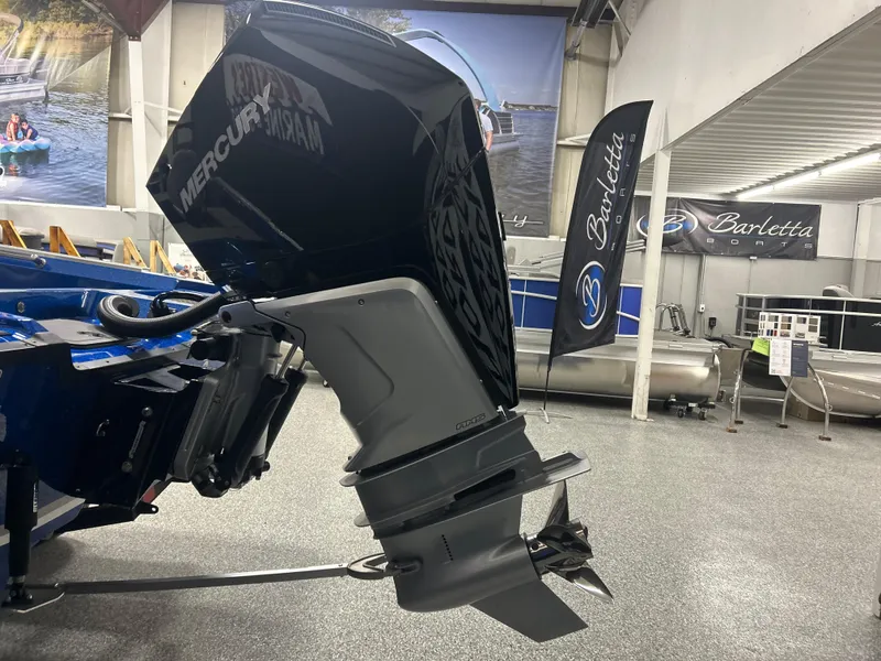 Slide: The Image of Outboard motor on a Nitro ZV20 boat, 2025 model, displayed indoors. - 8
