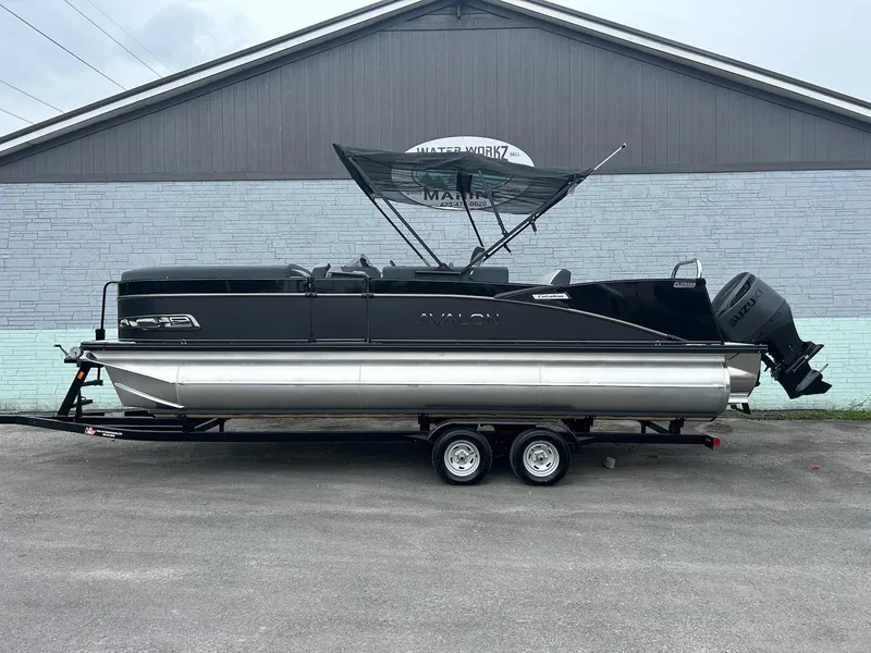 The Image of 2025 Avalon 2385 Catalina VRB pontoon boat on trailer, parked outdoors. - 1