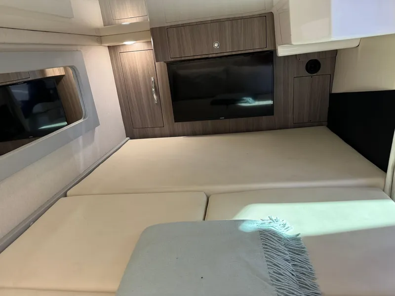 Slide: The Image of Interior cabin of 2020 Regal 35 Sport Coupe with modern design and TV. - 22
