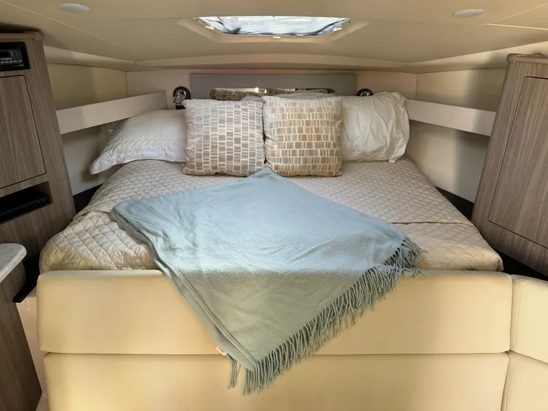 Slide: The Image of Luxurious cabin interior of 2020 Regal 35 Sport Coupe with cozy bedding. - 24
