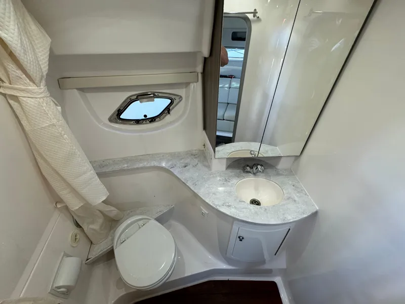 Slide: The Image of 2020 Regal 35 Sport Coupe bathroom with sink, toilet, and mirror. - 27