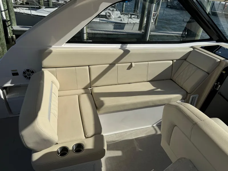 Slide: The Image of 2020 Regal 35 Sport Coupe interior with beige seating and cup holders. - 30
