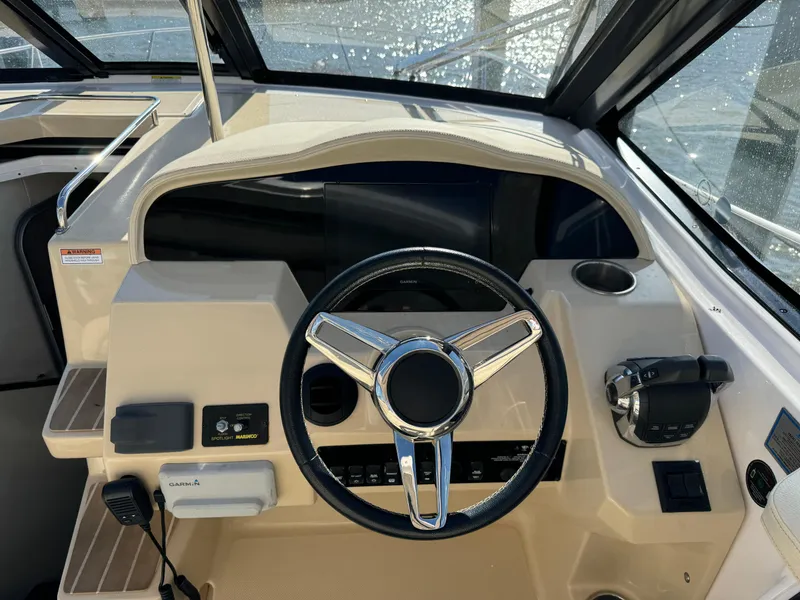 Slide: The Image of 2020 Regal 35 Sport Coupe helm with steering wheel and controls. - 37