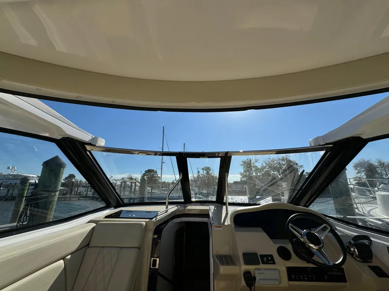 Slide: The Image of Interior view of 2020 Regal 35 Sport Coupe boat cockpit with steering wheel. - 38