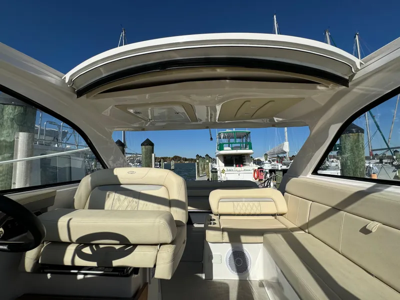 Slide: The Image of Interior view of 2020 Regal 35 Sport Coupe at marina dock. - 39