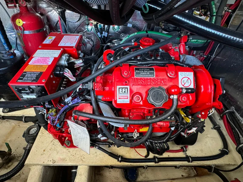 Slide: The Image of Engine compartment of 2020 Regal 35 Sport Coupe with red Westerbeke generator. - 44