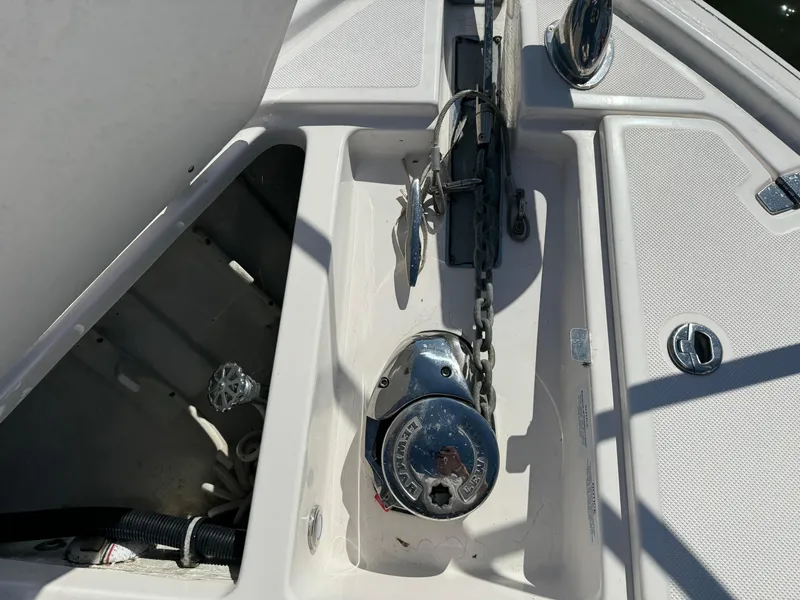 Slide: The Image of Anchor compartment of 2020 Regal 35 Sport Coupe with chain and winch. - 47