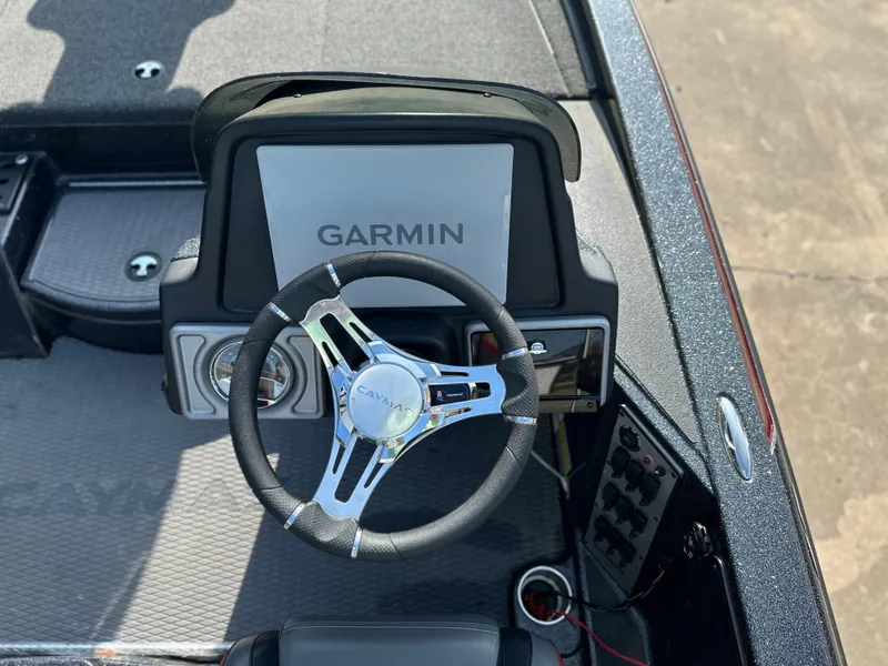 Slide: The Image of 2022 Caymas CX19 boat dashboard with Garmin display and steering wheel. - 5