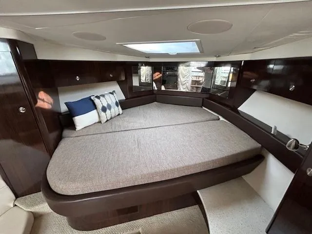 Slide: The Image of Luxurious interior cabin of 2016 Sea Ray 350 Sundancer yacht with plush bedding. - 21