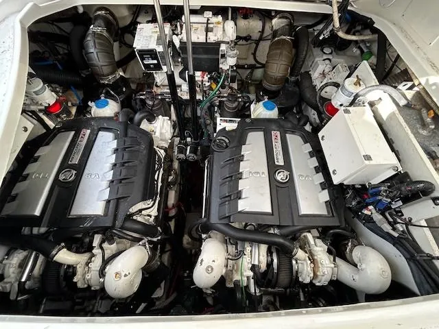 Slide: The Image of Engine compartment of 2016 Sea Ray 350 Sundancer with dual engines. - 27
