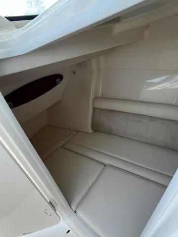 Slide: The Image of 2019 Grady-White Freedom 325 interior cabin with white seating and sleek design. - 11