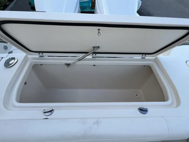 Slide: The Image of Open storage compartment on 2019 Grady-White Freedom 325 boat. - 18