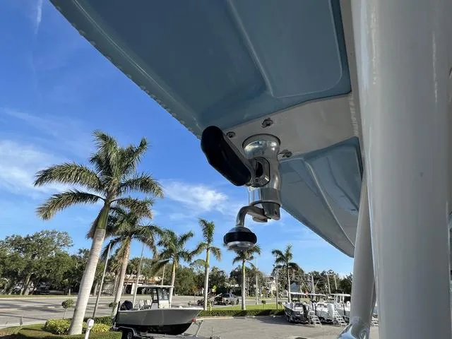 Slide: The Image of 2019 Grady-White Freedom 325 boat detail with palm trees in the background. - 19