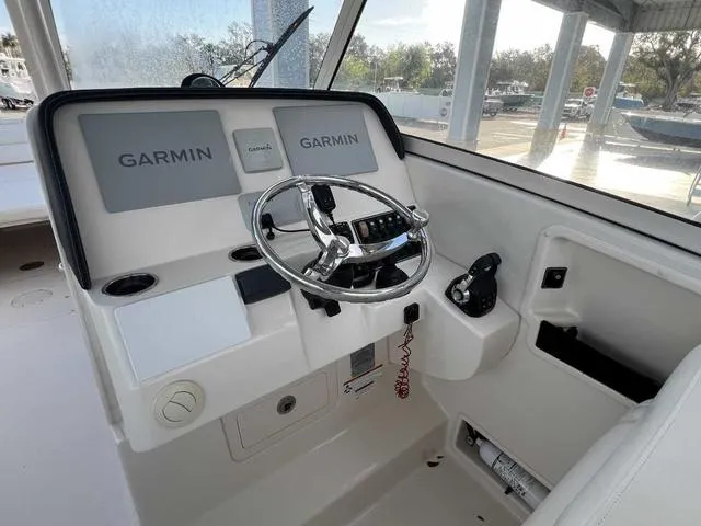 Slide: The Image of 2019 Grady-White Freedom 325 boat interior with spacious seating and modern design. - 28