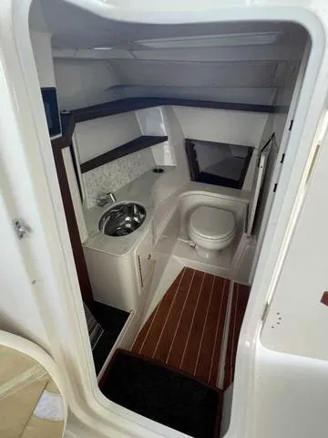 Slide: The Image of 2019 Grady-White Freedom 325 boat interior with white seating and spacious deck. - 32
