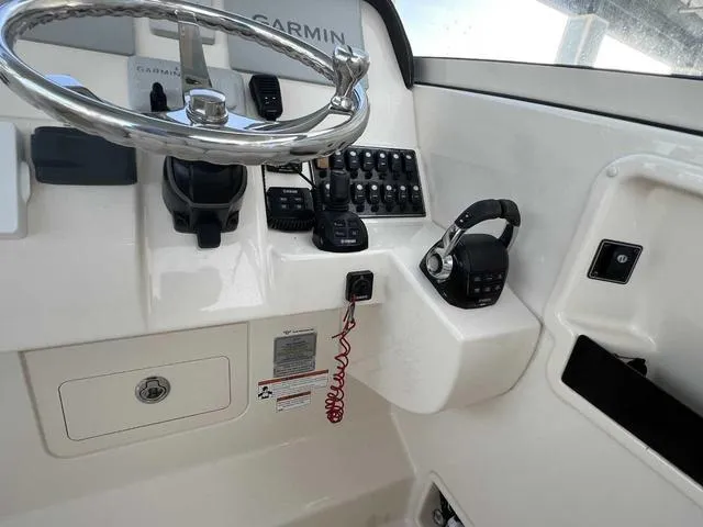 Slide: The Image of 2019 Grady-White Freedom 325 boat dashboard with Garmin navigation system. - 39