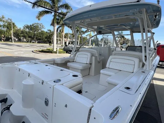 Slide: The Image of 2019 Grady-White Freedom 325 boat with spacious seating and sleek design. - 7
