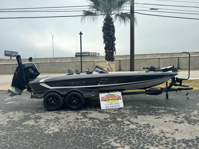 The Image of 2025 Vexus VXS21 boat on trailer, parked outdoors near palm tree. - 1