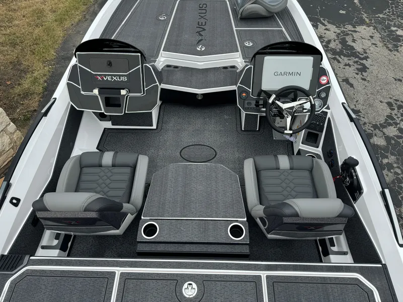 Slide: The Image of 2025 Vexus VXS21 boat interior with Garmin navigation, dual seats, and sleek design. - 10