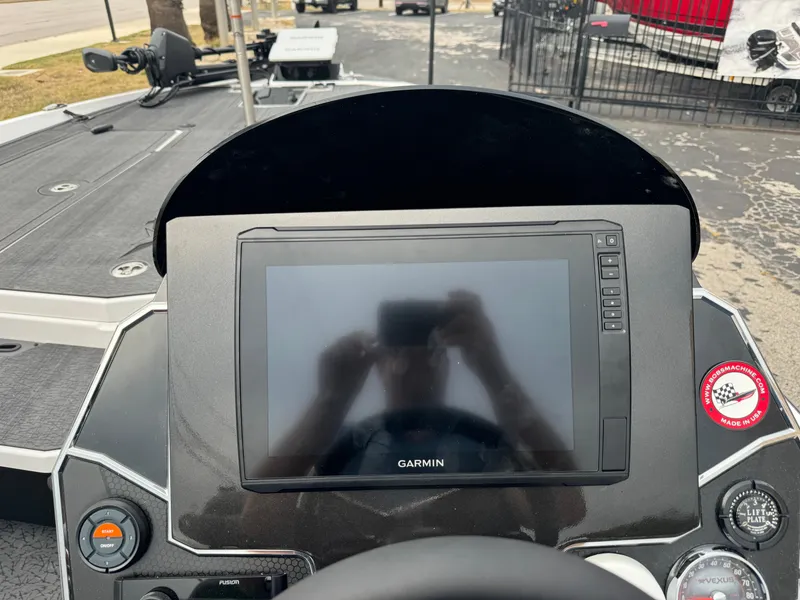 Slide: The Image of 2025 Vexus VXS21 boat dashboard with Garmin display and controls. - 12