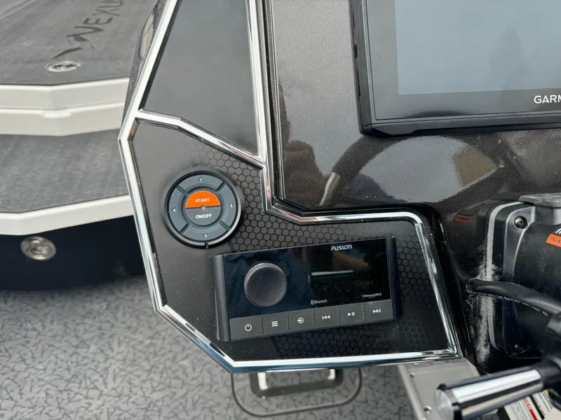 Slide: The Image of 2025 Vexus VXS21 boat dashboard with Garmin display and Fusion audio controls. - 13