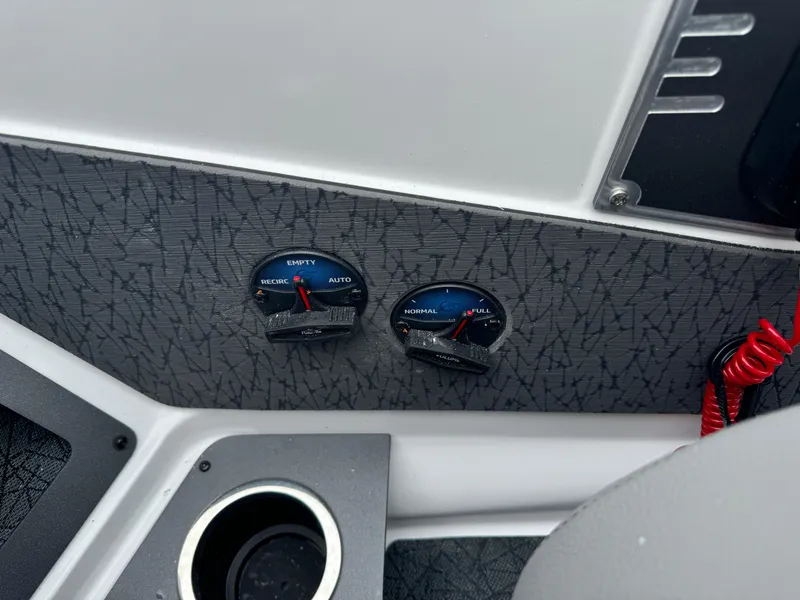 Slide: The Image of Dashboard of 2025 Vexus VXS21 boat with gauges and cup holder. - 17