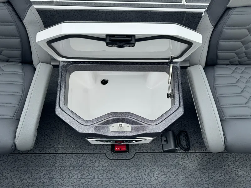 Slide: The Image of 2025 Vexus VXS21 boat interior with open storage compartment between seats. - 26