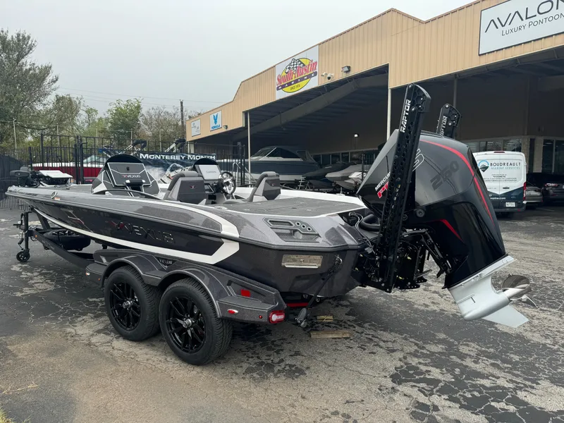 Slide: The Image of 2025 Vexus VXS21 boat on trailer, parked outside dealership. - 3