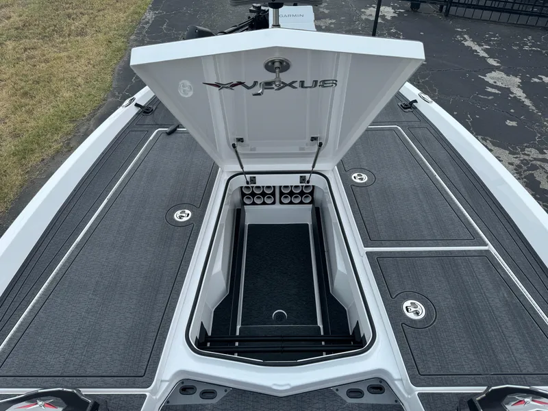 Slide: The Image of 2025 Vexus VXS21 boat storage compartment with open lid, showcasing organized interior. - 30